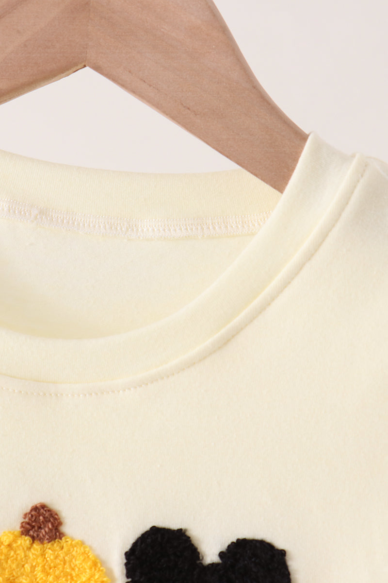Beige character french knot top