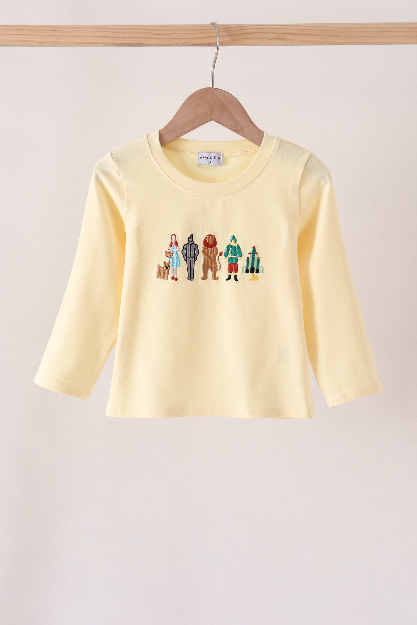Beige character embroidery top
